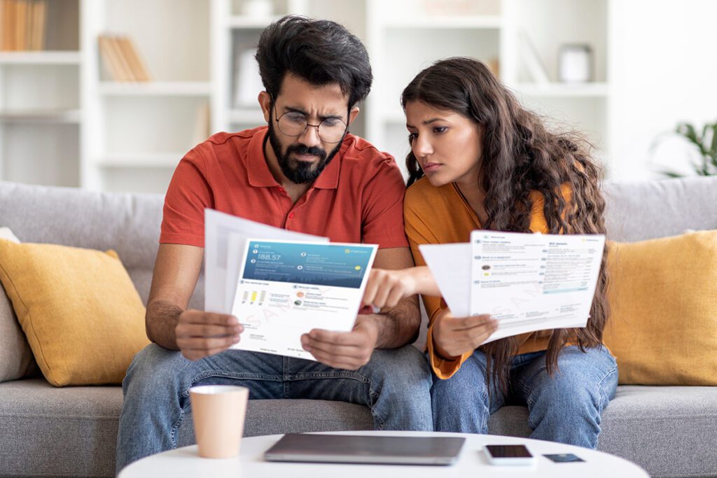 BC couple looking at Fortis gas bill